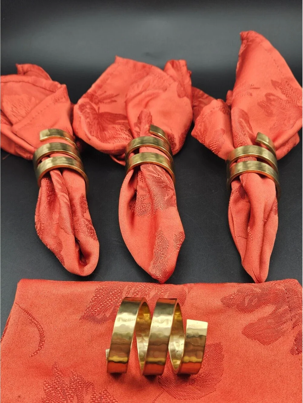 Set of 4 Spiral Hammered Brass Napkin Rings and 4 Red Napkins